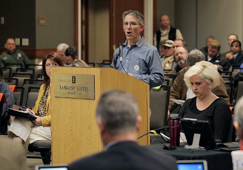 Audubon Arkansas Bird Conservation Director Dan Scheiman speaks to the state Plant Board, which met Wednesday in Little Rock to vote on regulations governing dicamba use next year.
(Arkansas Democrat-Gazette/John Sykes Jr.)