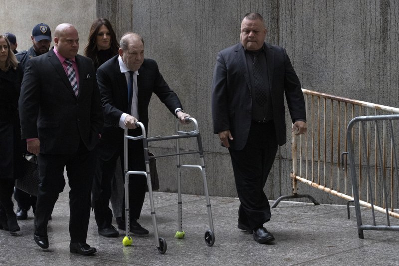 Harvey Weinstein, center, arrives for a court hearing, Wednesday, Dec. 11, 2019 in New York. (AP Photo/Mark Lennihan)