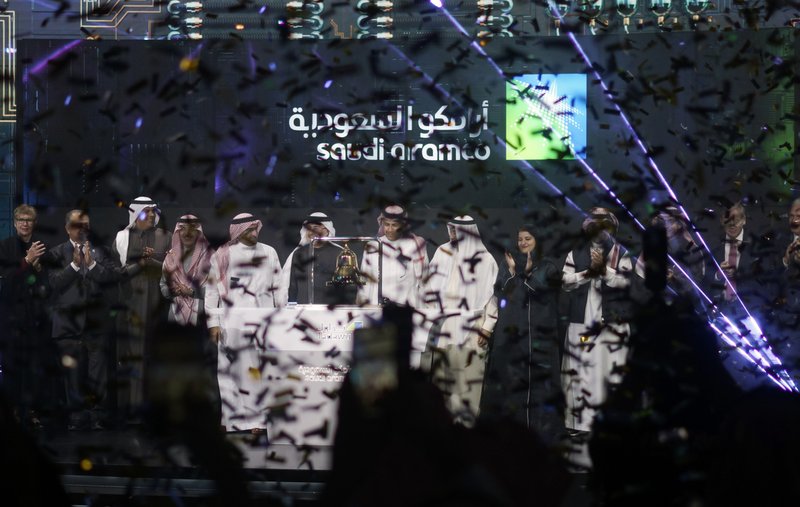 Saudi Arabia's state-owned oil company Saudi Armco and stock market officials celebrate during the official ceremony marking the debut of Aramco's initial public offering (IPO) on the Riyadh's stock market in Riyadh, Saudi Arabia
(The Associated Press/Amr Nabil)