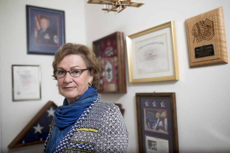 Elly Gibbons, photographed at her Fort Smith home in January 2018, has lobbied Congress for three years to get $5.7 billion in military survivors’ benefits restored to military widows and widowers like herself. “It has been a long and difficult journey,” Gibbons said Wednesday after the bill doing just that was approved in the House.
(NWA Democrat-Gazette/Charlie Kaijo)