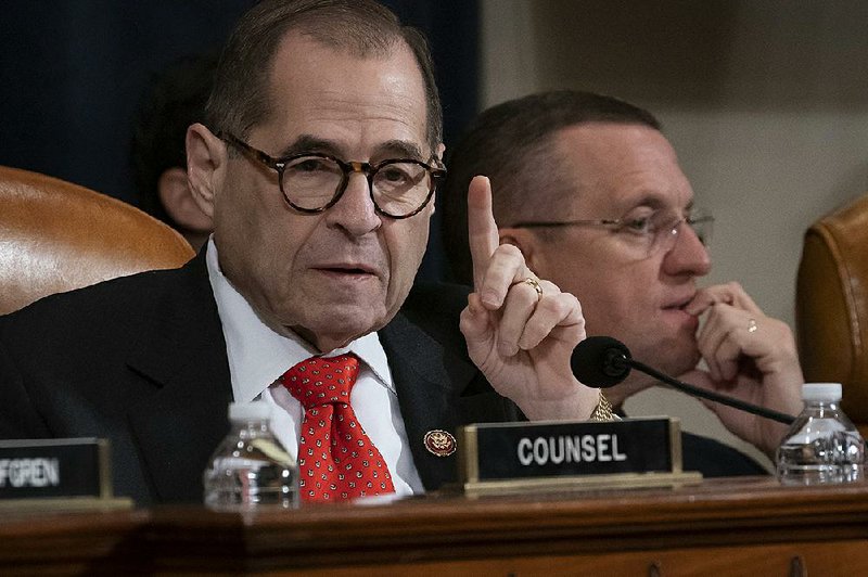 House Judiciary Committee Chairman Jerrold Nadler and ranking member Doug Collins, R-Ga., pre- side over a marathon session Thursday to determine articles of impeachment. Nadler warned against “a president subverting the fairness and integrity of our elections.” Collins called the proceedings “a farce.” More photos at arkansasonline.com/1213debate/.