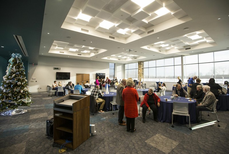 NWA Democrat-Gazette/BEN GOFF &#8226; @NWABENGOFF Guest mingle Tuesday in the event room during an open house at Northwest Arkansas Community College's new Washington County center in Springdale. The campus, next to Arvest Ballpark, will open for classes when the spring semester begins Jan. 13. Go to nwaonline.com/photos to see more photos.