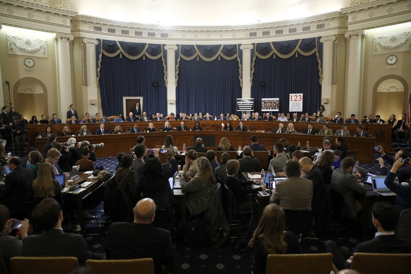 Member of the committee work during a House Judiciary Committee markup of the articles of impeachment against President Donald Trump, Friday, Dec. 13, 2019, on Capitol Hill in Washington. Trump impeachment goes to full House after Judiciary panel approves charges of abuse of power, obstruction of Congress.