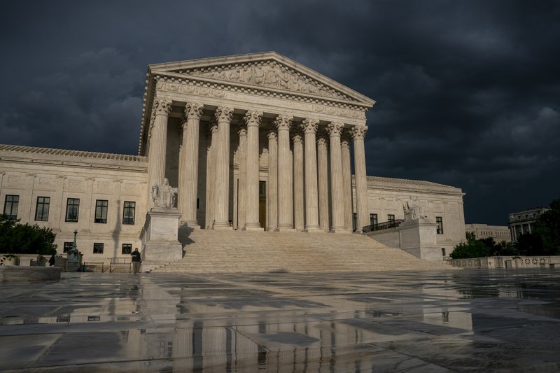 FILE - In this June 20, 2019 file photo, The Supreme Court is seen under stormy skies in Washington. The Supreme Court says it will hear President Donald Trump's pleas to keep his tax, bank and financial records private. (AP Photo/J. Scott Applewhite)