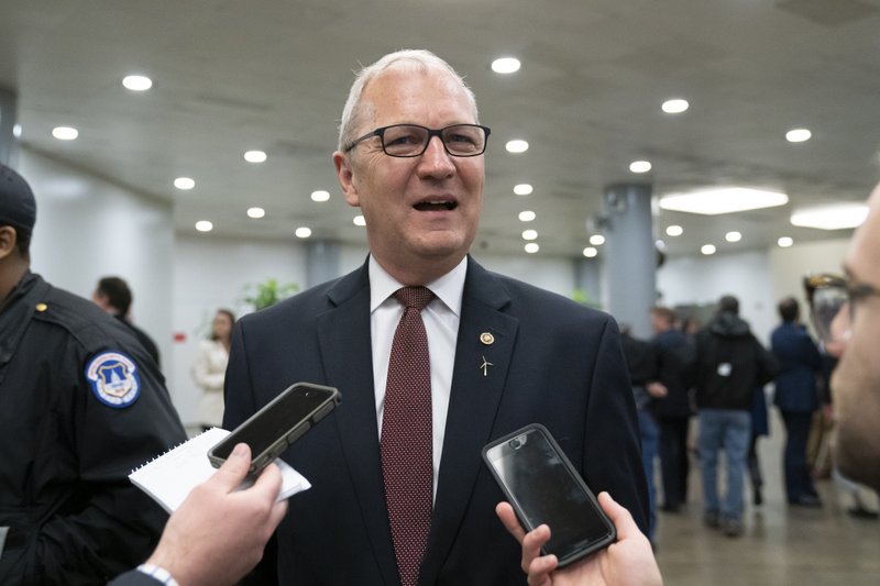 FILE - In this April 11, 2019, file photo Sen. Kevin Cramer, R-N.D., speaks to reporters after final votes, at the Capitol in Washington. Cramer has blocked a resolution that would recognize the mass killings of Armenians by Ottoman Turks a century ago as genocide. The Republican senator blocked a Senate vote on the resolution on Thursday, Dec. 5. (AP Photo/J. Scott Applewhite, File)