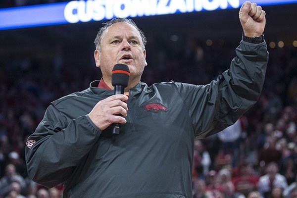 Arkansas football coach Sam Pittman speaks to the crowd during a basketball game between Arkansas and Tulsa on Saturday, Dec. 14, 2019, at Bud Walton Arena in Fayetteville.	