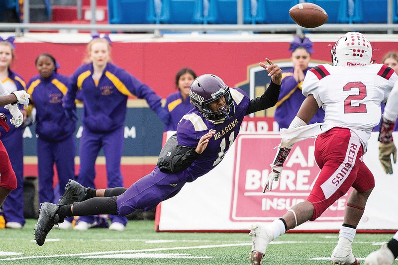 Junction City's Devontay Gilbert (11) lunges for a pass during the Class 2A state championship game at War Memorial Stadium in Little Rock on December 14, 2019.