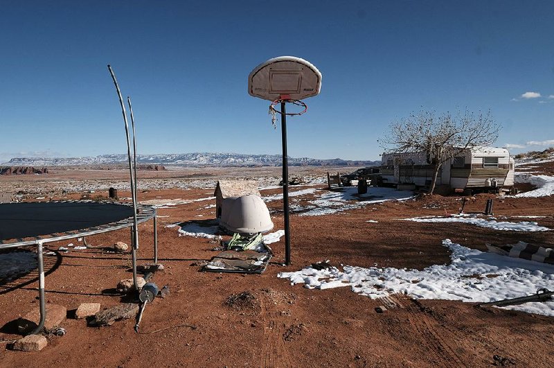 Sparse snow dots the landscape around Legena Wagner’s home in the Sweetwater Chapter of the Navajo Nation in northeast Arizona. Water has long been held sacred in the Navajo Nation, the country’s largest reservation, but a third of its 300,000 residents lack tap water or flushing toilets.