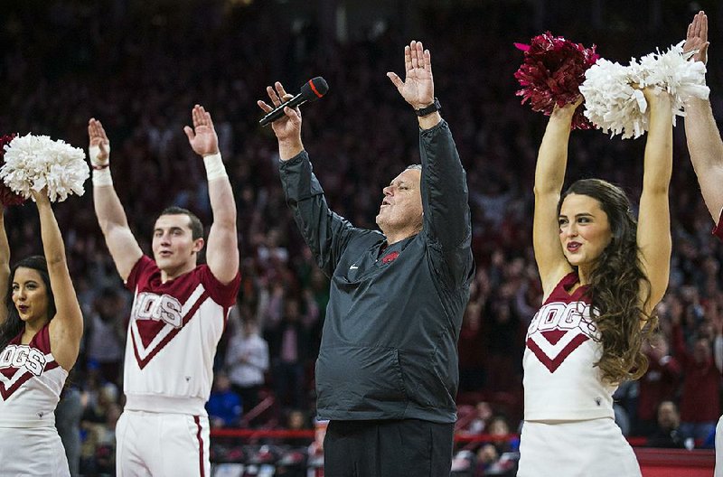 NWA Democrat-Gazette/BEN GOFF @NWABENGOFF
Sam Pittman, Arkansas football head coach, calls the hogs Saturday, Dec. 14, 2019, during a timeout in the basketball game at Walton Arena in Fayetteville.
Go to nwaonline.com/photos to see more photos.