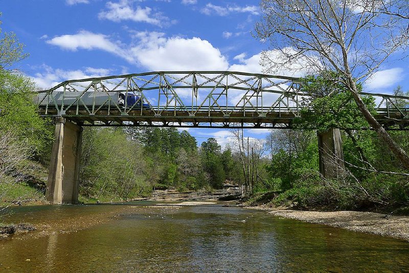 The Arkansas Highway and Transportation Department plans to tear down this 1931 bridge over the Buffalo National River at Pruitt after a new bridge is constructed. 