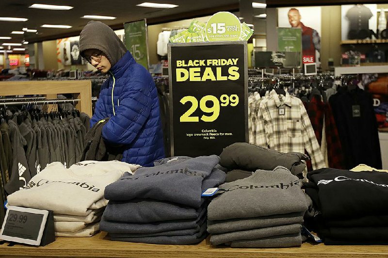 A sale at a Kohl’s store draws customers in Colma, Calif., last month, but the Commerce Department reported Friday that retail sales didn’t rise as much as forecast, with clothing outlets and restaurants posting declines.  