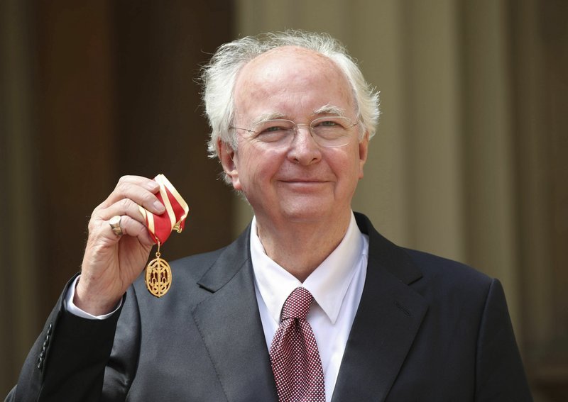 AP Author Philip Pullman holds the Knight Bachelor award presented to him in May at an investiture ceremony at Buckingham Palace in London. The British author's latest book, The Secret Commonwealth, is set in a world of mystery, magic, witches and daemons -- as well as untrustworthy politicians, manipulative charmers and fake news. HBO/AP Dafne Keen portrays Lyra in a scene with the armored bear Iorek Byrnison in HBO's His Dark Materials, based on Philip Pullman's trilogy of novels.