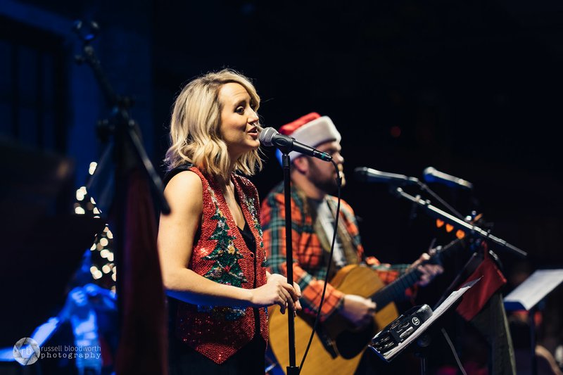 Photo courtesy Russell Bloodworth Photography Ken and Casey Weatherford are part of a group of musicians that play in front of the sing-along crowds at Beer and Hymns events; Ken is the executive director of the organization.