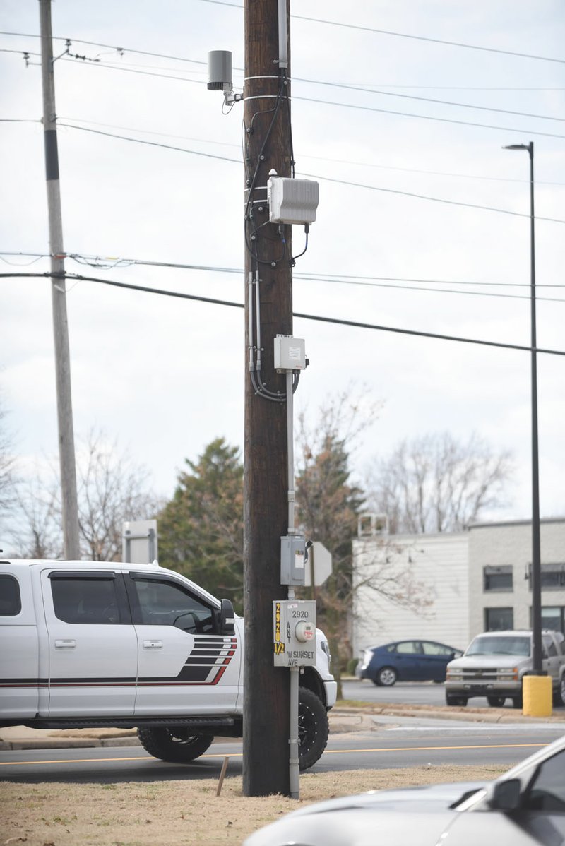 NWA Democrat-Gazette/DAVID GOTTSCHALK Fifth generation -- or 5G -- communication equipment is attached to a pole on west Sunset Avenue in Springdale. Northwest Arkansas cities have taken or working on steps to bring the technology to residents, yet keep it's placement under control.