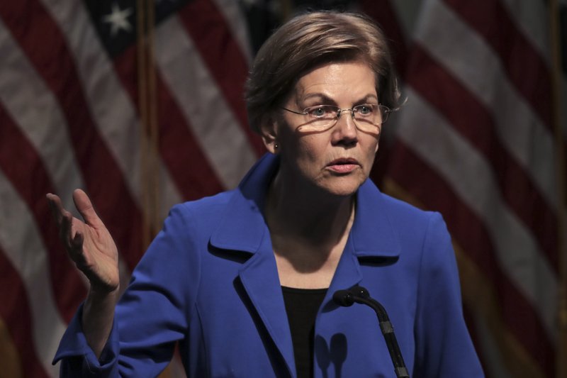 Democratic presidential candidate Sen. Elizabeth Warren, D-Mass., gestures during her address at the New Hampshire Institute of Politics in Manchester, N.H., Thursday, Dec. 12, 2019. (AP Photo/Charles Krupa)