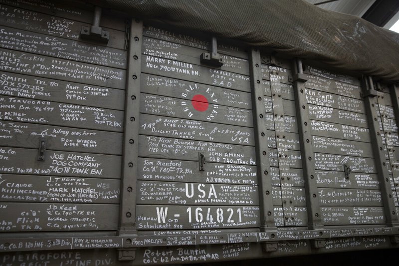 In this photo taken on Thursday, Nov. 7, 2019, names of veterans who have visited are written on the side of the U.S. Army truck, The Red Ball Express, at the Remember Museum 39-45 in Thimister-Clermont, Belgium. 