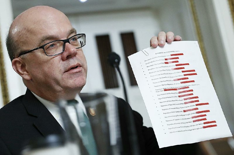 During a House Rules Committee session Tuesday, Chairman Jim McGovern displays a list of people and organizations that have not complied with impeachment investigators. More photos at arkansasonline.com/1218hearing/.
(AP/Andrew Harnik)