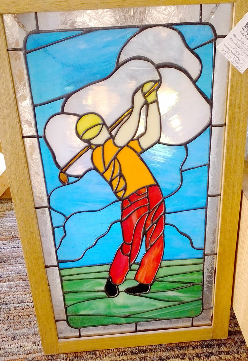 Lynn Atkins/The Weekly Vista A stained glass golfer at Wishing Spring Gallery could be the perfect Christmas gift.