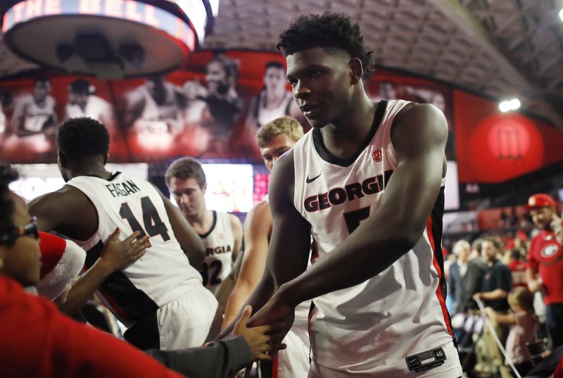 Georgia's Anthony Edwards (5) slaps hands with some young fans after the team's NCAA college basketball game against North Carolina Central on Wednesday, Dec. 4, 2019, in Athens, Ga. 
(Joshua L. Jones/Athens Banner-Herald via AP)