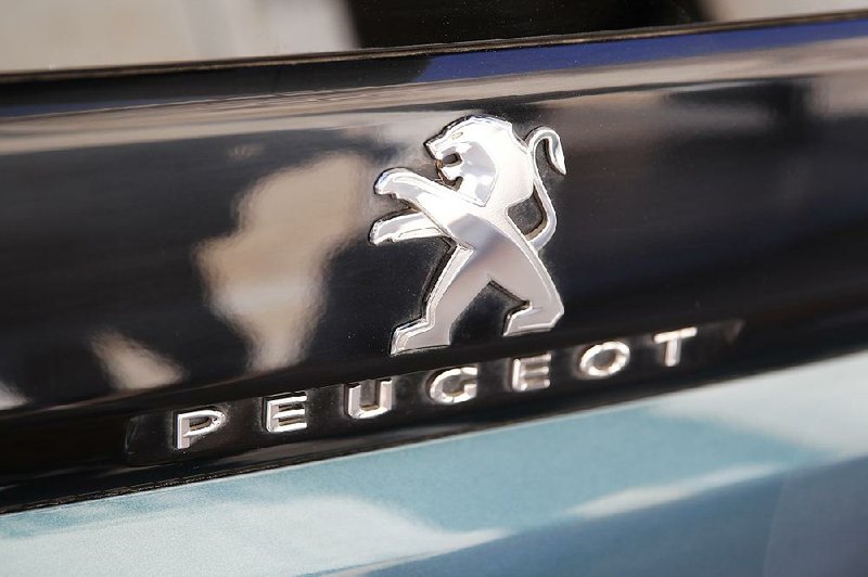 The merger of Fiat Chrysler Automobiles and PSA Peugeot is expected to close within 15 months if it clears antitrust and other regulatory hurdles.
(AP/Francois Mori)