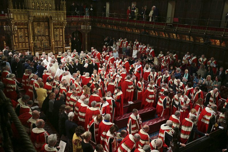 Members of the House of Lords and guests in the chamber ahead of the State Opening of Parliament by Queen Elizabeth II, in London, Thursday Dec. 19, 2019. Queen Elizabeth II formally opened a new session of Britain's Parliament on Thursday, with a speech giving the first concrete details of what Prime Minister Boris Johnson plans to do with his commanding House of Commons majority. (Aaron Chown, Pool via AP)