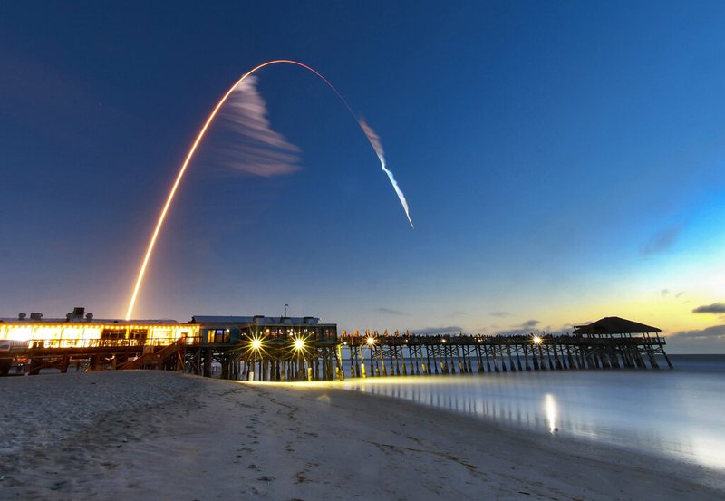 A United Launch Alliance Atlas V rocket carrying the Boeing Starliner crew capsule on an Orbital Flight Test to the International Space Station lifts off from Space Launch Complex 41 at Cape Canaveral Air Force station, Friday, Dec. 20, 2019, in this four minute time exposure of the launch with the Cocoa Beach, Fla., Pier in the foreground. (Malcolm Denemark/Florida Today via AP)
