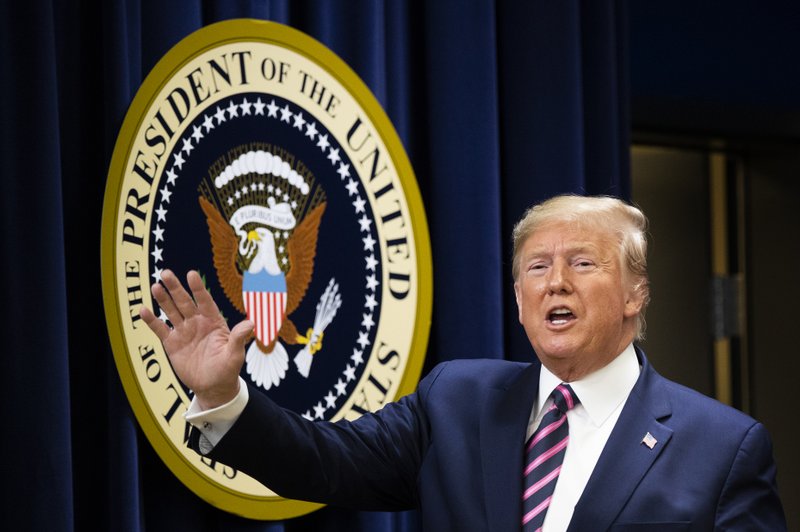 President Donald Trump waves during a summit on transforming mental health treatment to combat homelessness, violence, and substance abuse, at the he Eisenhower Executive Office Building on the White House complex in Washington, Thursday, Dec. 19, 2019, in Washington. (AP Photo/Manuel Balce Ceneta)