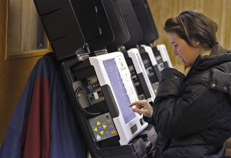 Voting Machines: In this file photo, Election Systems Software Technician Jessica Simmons inputs passwords into new voting machines for Union County in February of this year. The county received 54 ExpressVote machines last year. Officials hope switching to a voting center system will extend the use of the machines.