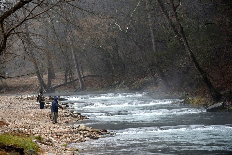 In this file photo anglers fish in a cold rain on Nov. 29 2019 at Roaring River State Park. 
(NWA Democrat-Gazette/FLIP PUTTHOFF)