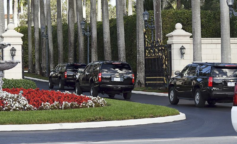 A motorcade carrying President Donald Trump arrives Tuesday at the Trump International Golf Club West Palm Beach, where Trump played some golf.
(AP/Jim Rassol)