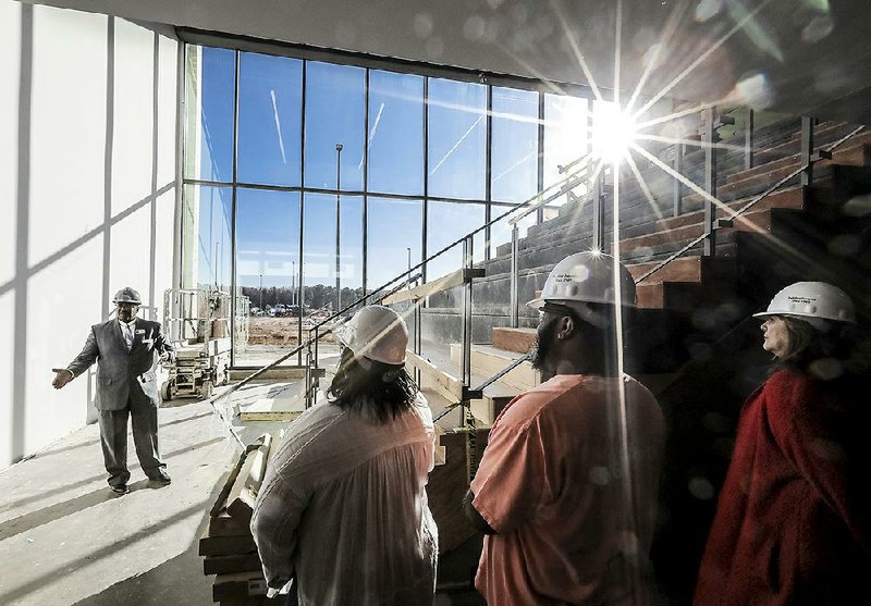 Marvin Burton, the principal of Southwest High, gives faculty and staff members from McClellan and J.A. Fair high schools a tour of the new school last week. McClellan and J.A. Fair are merging into the new high school, which is under construction in southwest Little Rock.
(Arkansas Democrat-Gazette/John Sykes Jr.)