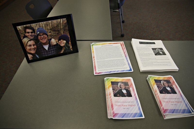 Photos, articles and letters are laid out on display before a ceremony honoring Tessa Majors on Saturday, Dec. 21, 2019 at St. Anne's Belfield School in Charlottesville, Va.. Relatives and friends of the 18-year-old Barnard student who was killed in New York City on Dec. 11, will come together in her hometown to honor and remember her life. (Erin Edgerton/The Daily Progress via AP)

