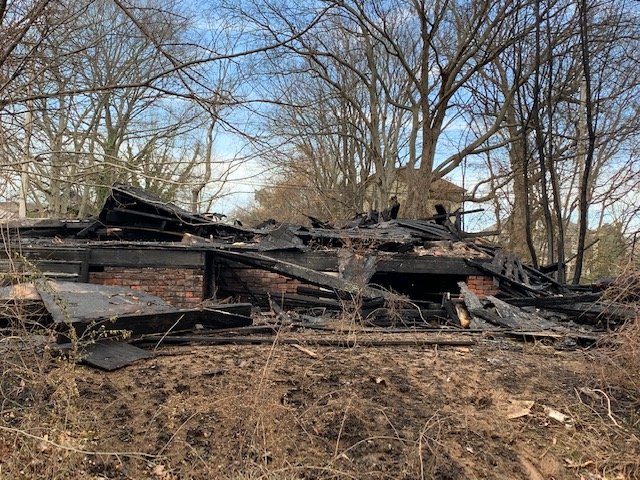The remains of The Schmelzer House, at 1414 Park Lane, after a fire Wednesday night destroyed the historic home.
