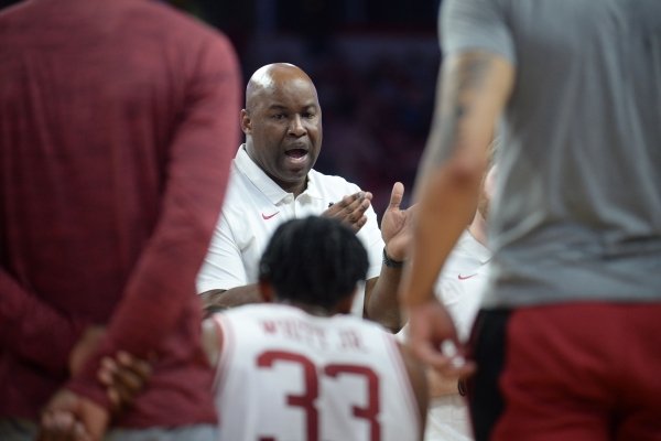 Arkansas associate head coach Chris Crutchfield speaks to his team Friday, Nov. 22, 2019, during the second half of play against South Dakota in Bud Walton Arena in Fayetteville.