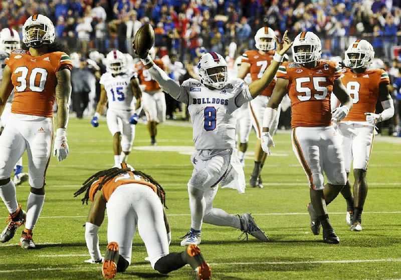 J’Mar Smith (center) ran for a touchdown and passed for another to lead Louisiana Tech past Miami 14-0 on Thursday in the Independence Bowl at Independence Stadium in Shreveport.
(AP/The Shreveport Times/Henriette Wildsmith)