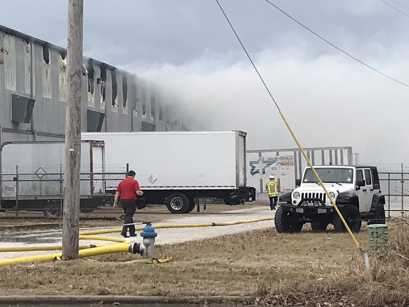 Springdale firefighters battle a warehouse fire Friday, Dec. 27 on Randall Wobbe Lane in Springdale. 