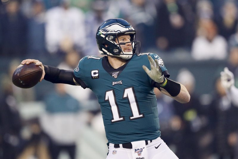 Philadelphia Eagles quarterback Carson Wentz throws a pass during the first half of an NFL football game against the Dallas Cowboys Sunday, Dec. 22, 2019, in Philadelphia. 
(AP Photo/Michael Perez)