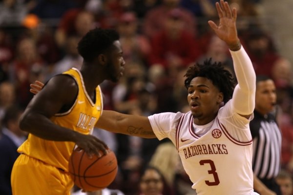 Arkansas’ Desi Sills (3) guards Valparaiso's Donovan Clay (5) during the first half of the Razorbacks' 72-68 win over Valparaiso on Saturday, Dec. 21, 2019, at Simmons Bank Arena in North Little Rock. 