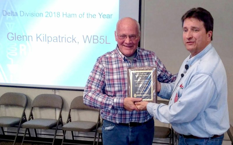 Courtesy Photo Glenn Kilpatrick, outgoing president of the Bella Vista Radio Club, receives the prestigious 2018 Ham of the Year award from David Norris on Dec. 5.