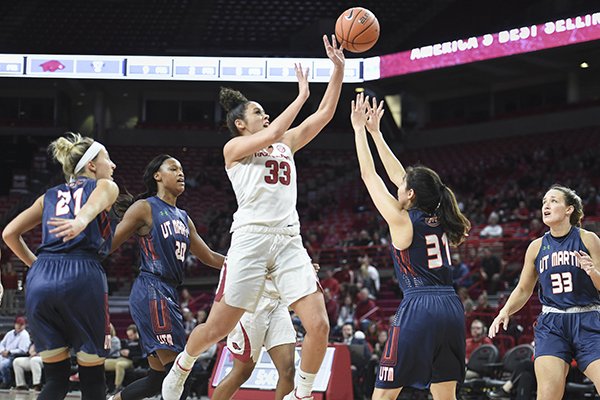 Arkansas guard Chelsea Dungee (33) shoots over Tennessee-Martin defenders Sunday, Dec. 29, 2019, during a game at Bud Walton Arena in Fayetteville.