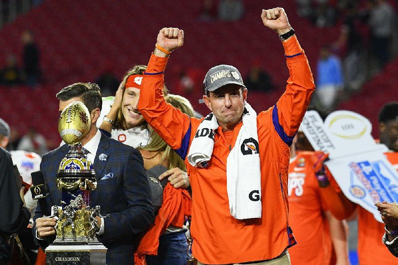 Clemson Coach Dabo Swinney celebrates after the Tigers won the Fiesta Bowl over Ohio State on Saturday night to advance to the College Football Playoff Championship Game against LSU. The title game will be played Jan. 13 in New Orleans.