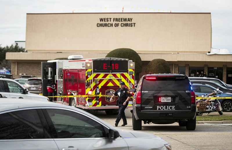 Police and fire departments surround the scene of a shooting at West Freeway Church of Christ in White Settlement, Texas, Sunday, Dec. 29, 2019. (Yffy Yossifor/Star-Telegram via AP)

