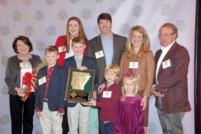 I.F. Anderson Farms Inc. of Lonoke was named the 2019 Arkansas Farm Family of the Year. Accepting the award at the Dec. 12 luncheon are, front row, from left, Warner Anderson, Slater Anderson, Collins Siever and Sloane Siever; and back row, Kaye Anderson, Elizabeth Anderson, James Neal Anderson Jr. (better known as Jamie), Katie Siever and James “Neal” Anderson.