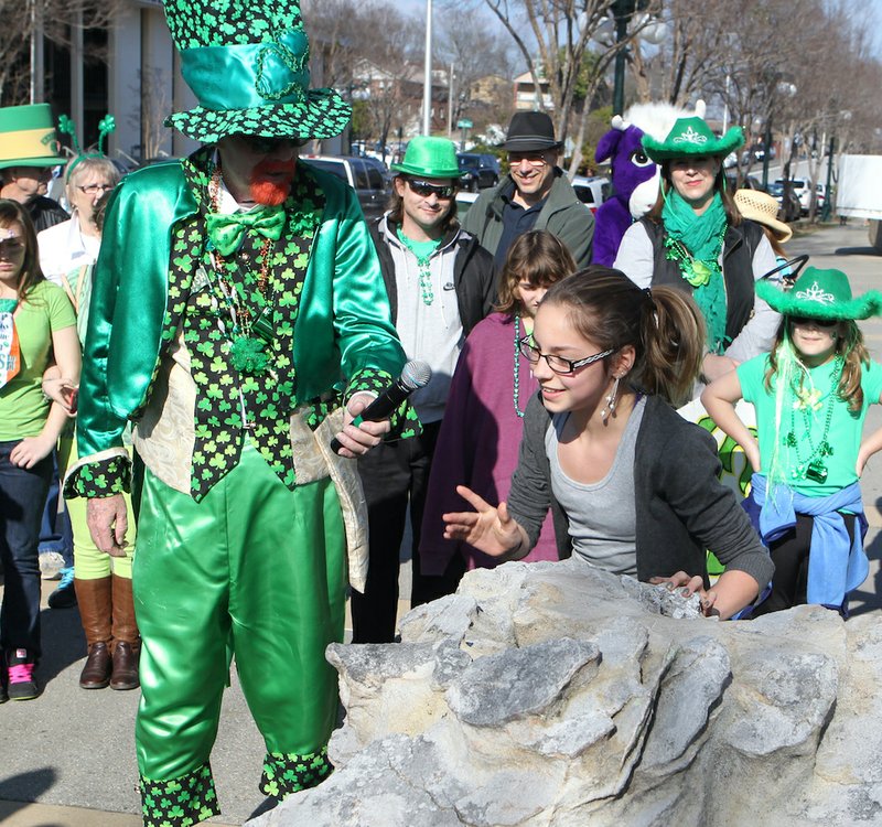 Retiring World's Tallest Leprechaun Dick Antoine, left, presides over the Blarney Stone Kissing Contest in 2014. - File photo by The Sentinel-Record