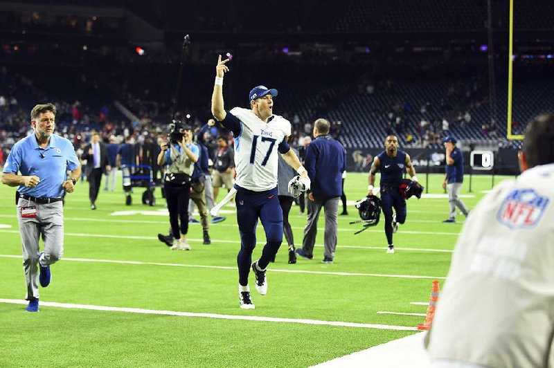Tennessee Titans quarterback Ryan Tannehill (17) celebrates after an NFL football game against the Houston Texans Sunday, Dec. 29, 2019, in Houston. The Titans won 35-14. 
(AP Photo/Eric Christian Smith)
