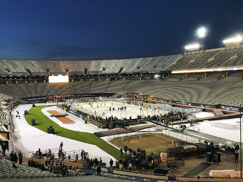 The Nashville Predators go through practice at the Cotton Bowl in Dallas on Tuesday before playing in today’s NHL Winter Classic against the Dallas Stars. More than 84,000 fans are expected to attend the event.
(AP/Stephen Hawkins)