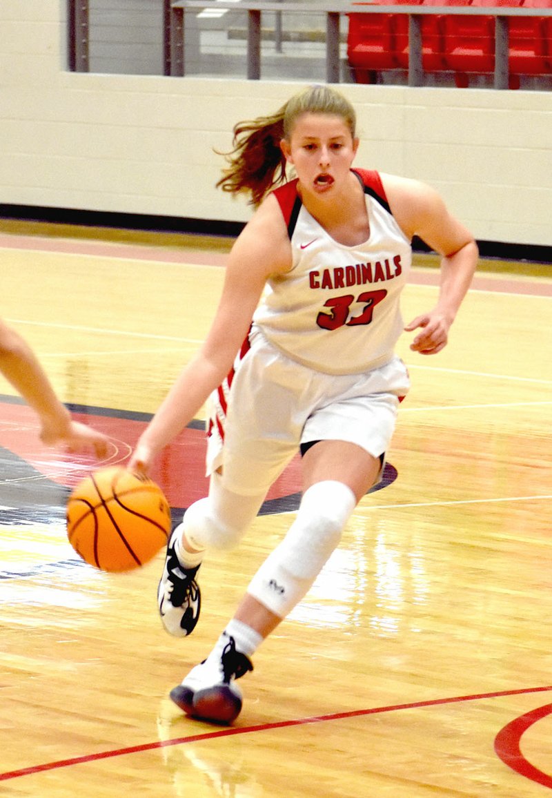 MARK HUMPHREY ENTERPRISE-LEADER/Farmington senior Joelle Tidwell shows her versatility by driving with the basketball. Tidwell had 9 points during the Lady Cardinals' 66-57 loss to Macon County, of Lafayette, Teen, at the Lady Golden Eagle Invitational hosted by Greene County Tech on Dec. 6.