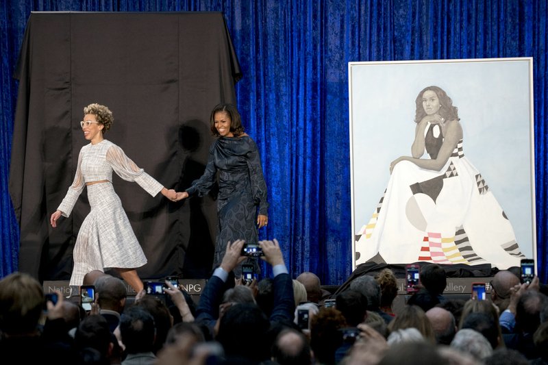 Former first lady Michelle Obama and Artist Amy Sherald (left) unveil Michelle Obama's official portrait at the Smithsonian's National Portrait Gallery on Feb. 12, 2018, in Washington. Sherald's piece Precious jewels by the sea is one of four acquisitions by female artists announced Tuesday by the Crystal Bridges Museum of American Art.
(Courtesy Photo/ANDREW HARNIK )