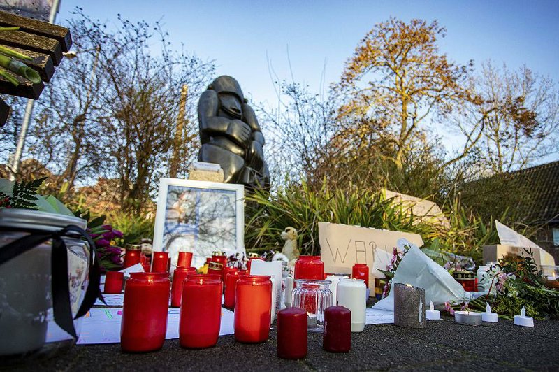 Well-wishers’ candles, pictures, stuffed animals and signs adorn the main entrance Wednesday to the Krefeld Zoo in the Rhine-Westphaplia region of Germany, where a fire just minutes into the new year killed more than 30 zoo animals.
(AP/Chirstoph Reichwein)
