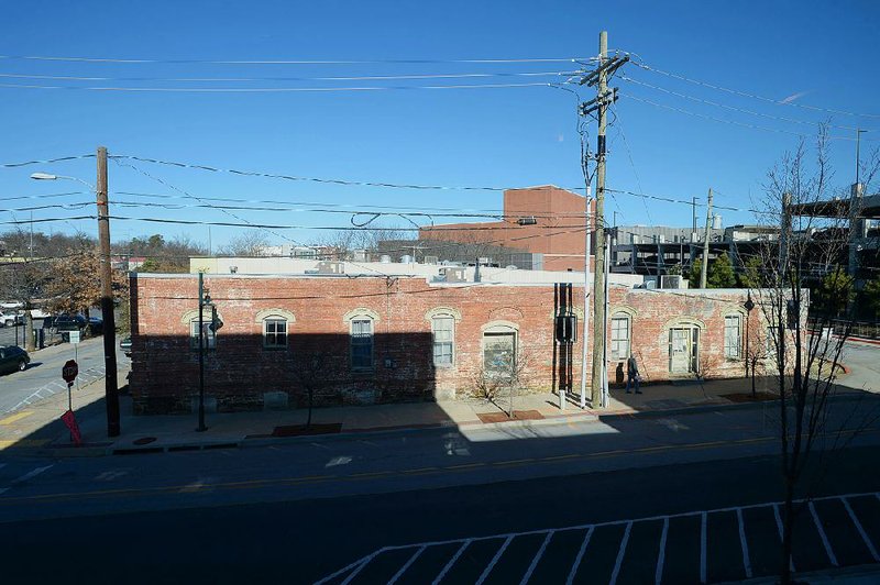 The former Porter Produce building stands at Spring Street and West Avenue in Fayetteville. The city included $400,000 in next year’s budget to restore the foundation of the building. The structure was home to the Porter Produce House from the 1960s through the 1990s. It has largely been used for storage in recent years.
(NWA Democrat-Gazette/Andy Shupe)